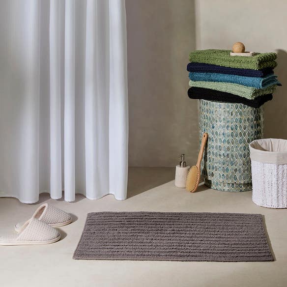 https://s3-ap-southeast-2.amazonaws.com/fusionfactory.commerceconnect.bbnt.production/pim_media/000/208/057/M_F_Devon-Bath-Mat_Charcoal_20481403_R_LS_SI.jpg?1770169979
