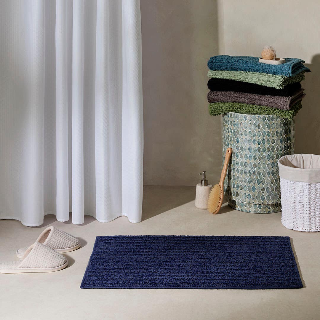 https://s3-ap-southeast-2.amazonaws.com/fusionfactory.commerceconnect.bbnt.production/pim_media/000/208/067/M_F_Devon-Bath-Mat_Navy_20481410_R_LS_SI.jpg?1770170412
