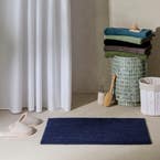 https://s3-ap-southeast-2.amazonaws.com/fusionfactory.commerceconnect.bbnt.production/pim_media/000/208/067/M_F_Devon-Bath-Mat_Navy_20481410_R_LS_SI.jpg?1770170412