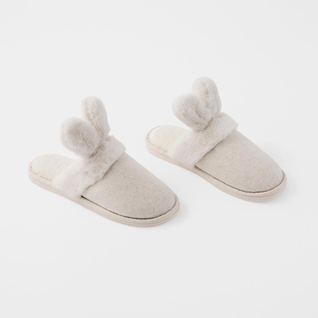 https://s3-ap-southeast-2.amazonaws.com/fusionfactory.commerceconnect.bbnt.production/pim_media/000/210/844/M_F_Easter26_Fur-Bunny-Slippers_S-M_26640101_V2_SI.jpg?1773098161