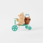 https://s3-ap-southeast-2.amazonaws.com/fusionfactory.commerceconnect.bbnt.production/pim_media/000/204/893/M_F_Easter26_T2-Chick--on-Bike-w-Basket_Yellow-Blue_26616201_SI.jpg?1764129769
