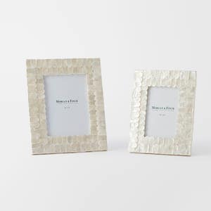 https://s3-ap-southeast-2.amazonaws.com/fusionfactory.commerceconnect.bbnt.production/pim_media/000/169/411/M_F_Issey-Inlay-Photo-Frame-5x7_Ivory_25881601_SI.jpg?1725601904