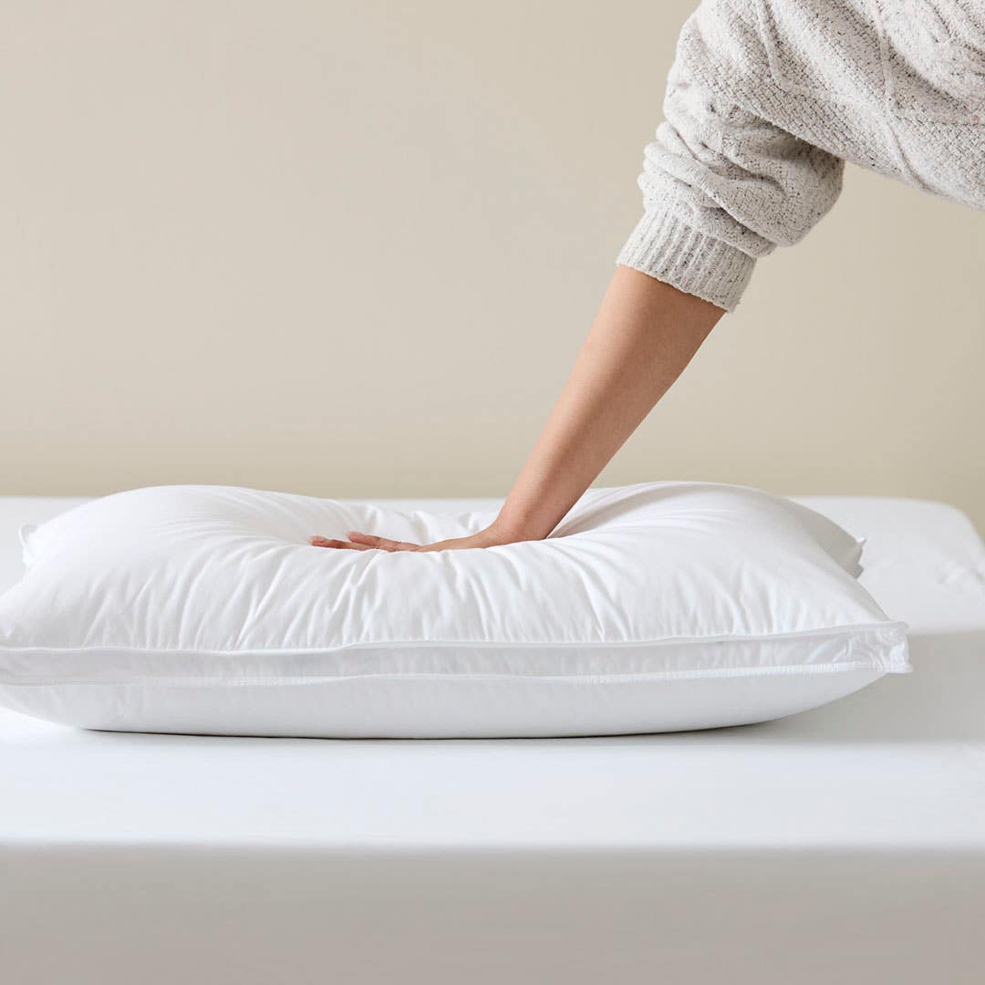 https://s3-ap-southeast-2.amazonaws.com/fusionfactory.commerceconnect.bbnt.production/pim_media/000/173/550/M_F_S24-25_Cat-Stacks_Pillow_Firmness_Test_Luxury_Goose_Surround_SI.jpg?1729548696