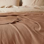 https://s3-ap-southeast-2.amazonaws.com/fusionfactory.commerceconnect.bbnt.production/pim_media/000/154/507/M_F_S24_Sebastian_Waffle_Blanket_Clay_Detail-1_SI.jpg?1696889316