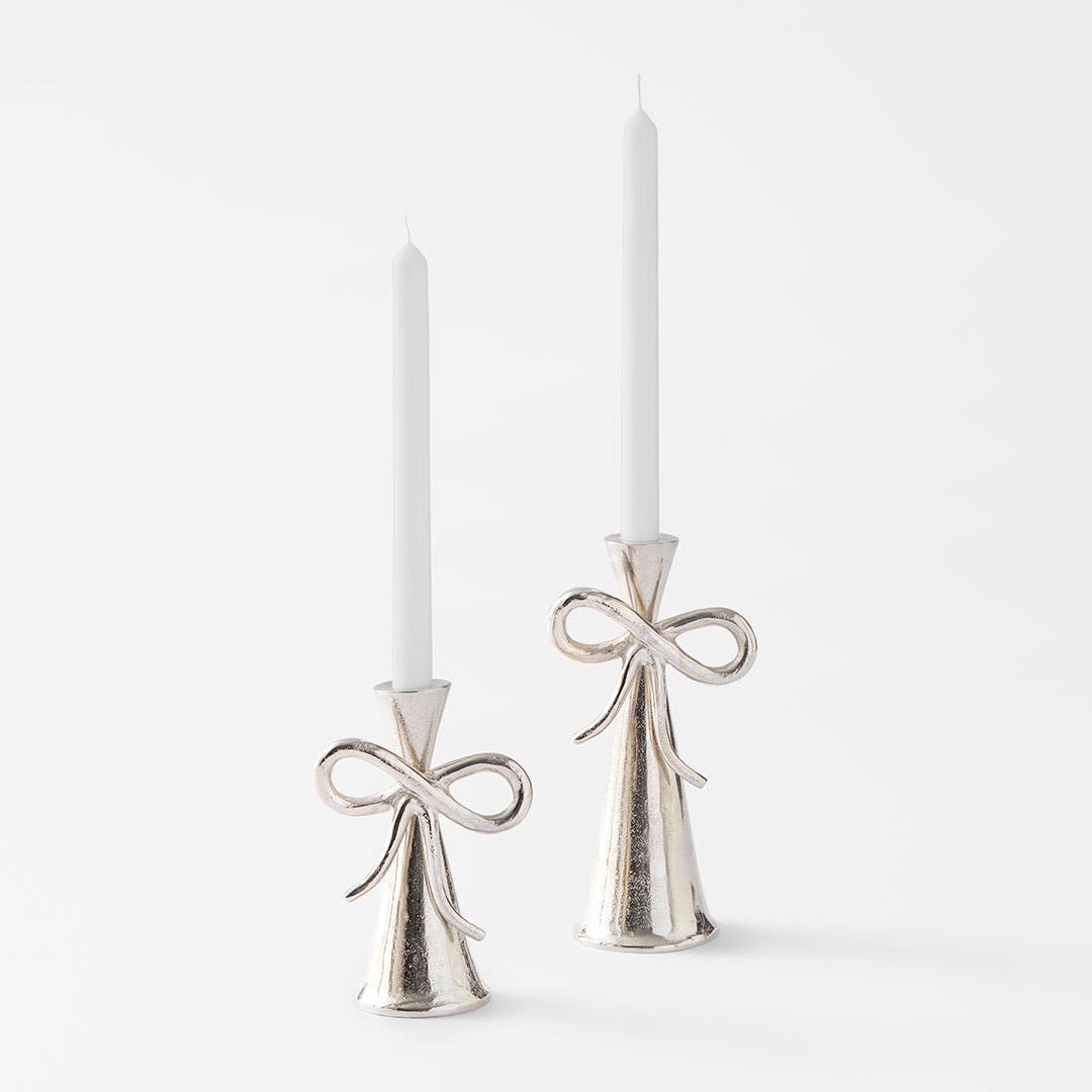 https://s3-ap-southeast-2.amazonaws.com/fusionfactory.commerceconnect.bbnt.production/pim_media/000/203/289/M_F_S25-26_Bow-Metal-Candle-Holder-Range_Silver_26599_R_SI.jpg?1761194484
