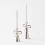 https://s3-ap-southeast-2.amazonaws.com/fusionfactory.commerceconnect.bbnt.production/pim_media/000/203/289/M_F_S25-26_Bow-Metal-Candle-Holder-Range_Silver_26599_R_SI.jpg?1761194484