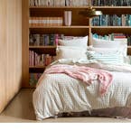 https://s3-ap-southeast-2.amazonaws.com/fusionfactory.commerceconnect.bbnt.production/pim_media/000/173/986/M_F_Summer_S24-25_LS_Location_Bedlinen_Leah_Blush_QQC_Hero_No_Foliage.jpg?1729739511