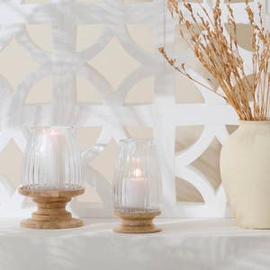 https://s3-ap-southeast-2.amazonaws.com/fusionfactory.commerceconnect.bbnt.production/pim_media/000/174/045/M_F_Summer_S25-25_LS_Studio_Decorator_Ginny_Wood_Base_Hurricane_Natural_Clear_25871.jpg?1729744471