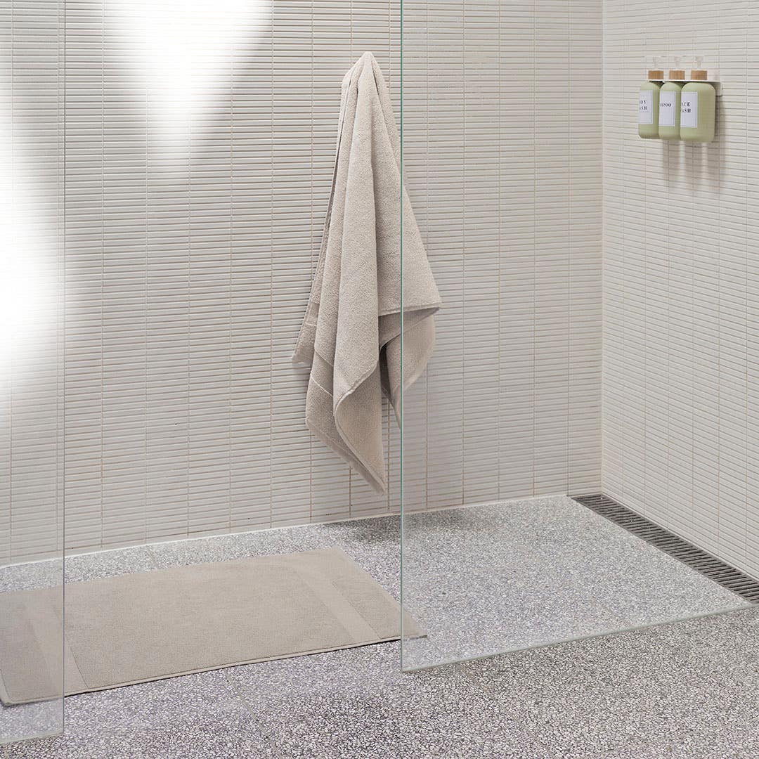 https://s3-ap-southeast-2.amazonaws.com/fusionfactory.commerceconnect.bbnt.production/pim_media/000/200/496/M_F_Summer_S25-26_LS_Bathroom_Towel_Bathmat-Ultra_Soft_Oatmeal_SI.jpg?1757027867