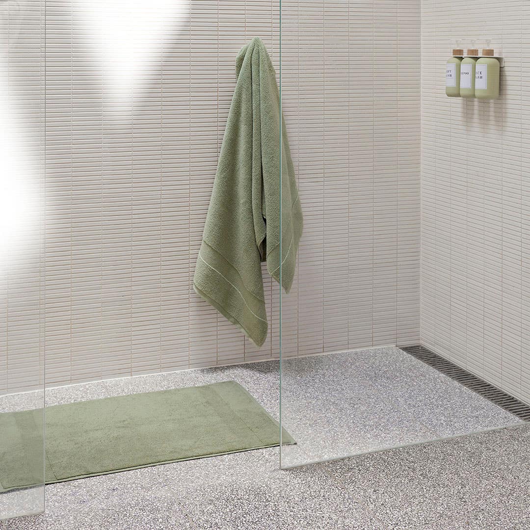 https://s3-ap-southeast-2.amazonaws.com/fusionfactory.commerceconnect.bbnt.production/pim_media/000/200/508/M_F_Summer_S25-26_LS_Bathroom_Towel_Bathmat-Ultra_Soft_Sage_SI.jpg?1757029638