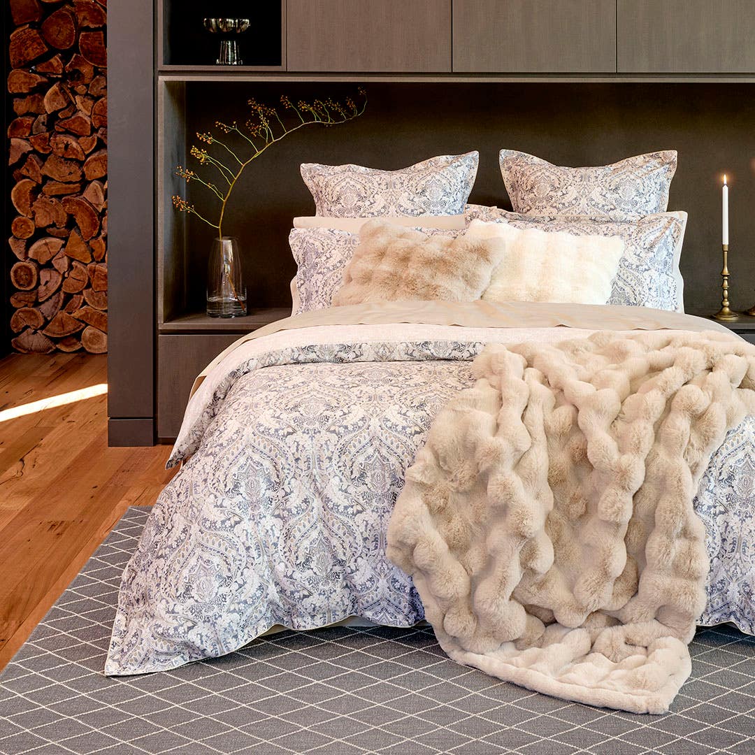 https://s3-ap-southeast-2.amazonaws.com/fusionfactory.commerceconnect.bbnt.production/pim_media/000/193/482/M_F_W25_LS_Location_Antonio_Malmo_Fur_Pumace_Cushion_Throw_Hero_SI.jpg?1744323583