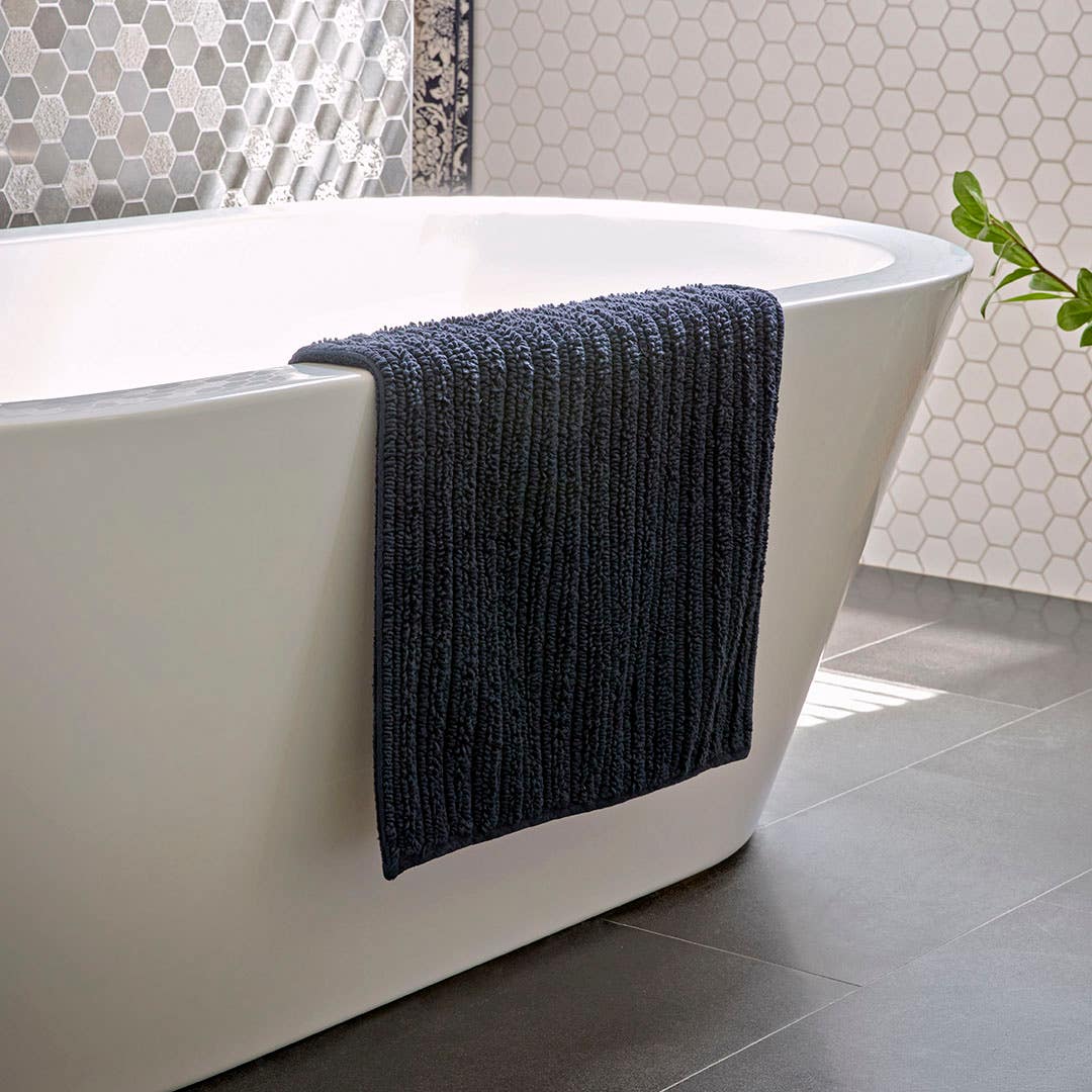 https://s3-ap-southeast-2.amazonaws.com/fusionfactory.commerceconnect.bbnt.production/pim_media/000/194/043/M_F_W25_LS_Location_Bathroom_Devon_Navy_SI.jpg?1745301089