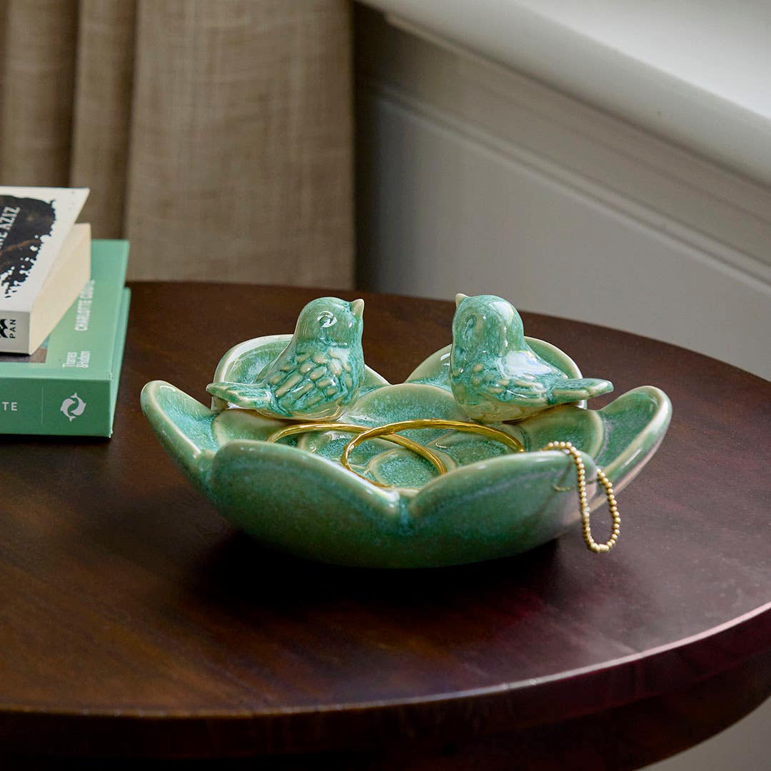 https://s3-ap-southeast-2.amazonaws.com/fusionfactory.commerceconnect.bbnt.production/pim_media/000/210/494/M_F_W26_Autumn_LS_Decorator_Two-Birds-Ceramic-Dish_Green_26911801_SI.jpg?1772503452