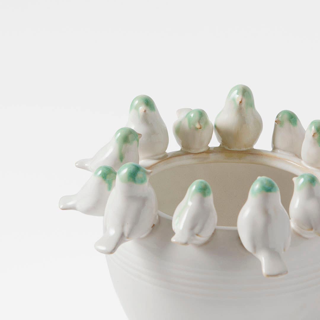 https://s3-ap-southeast-2.amazonaws.com/fusionfactory.commerceconnect.bbnt.production/pim_media/000/205/600/M_F_W26_Birdsong-Ceramic-Vase_White-Green_26911401_Detail_SI.jpg?1765339663