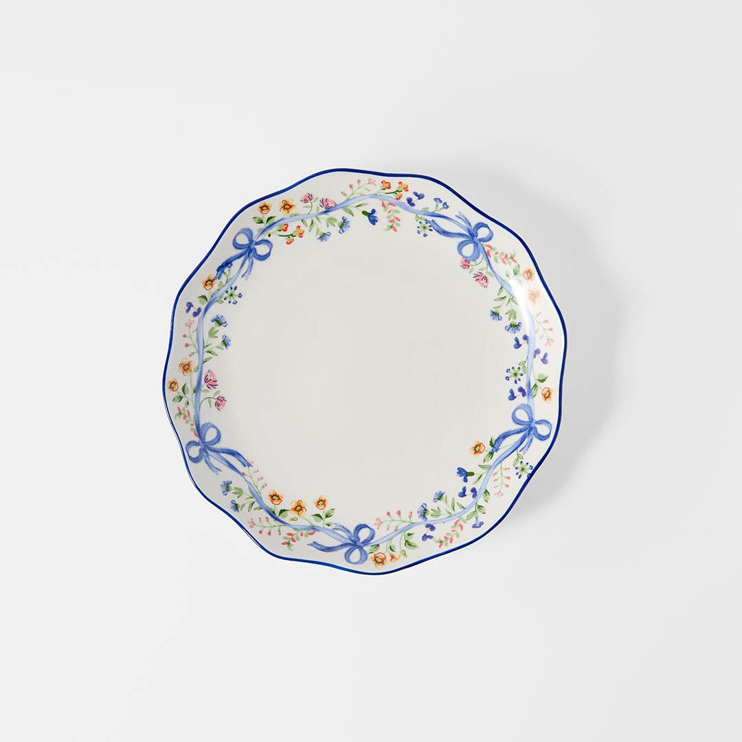 https://s3-ap-southeast-2.amazonaws.com/fusionfactory.commerceconnect.bbnt.production/pim_media/000/206/435/M_F_W26_Floral-Bow-Dinner-Plate_Blue_26854101_SI.jpg?1767156932