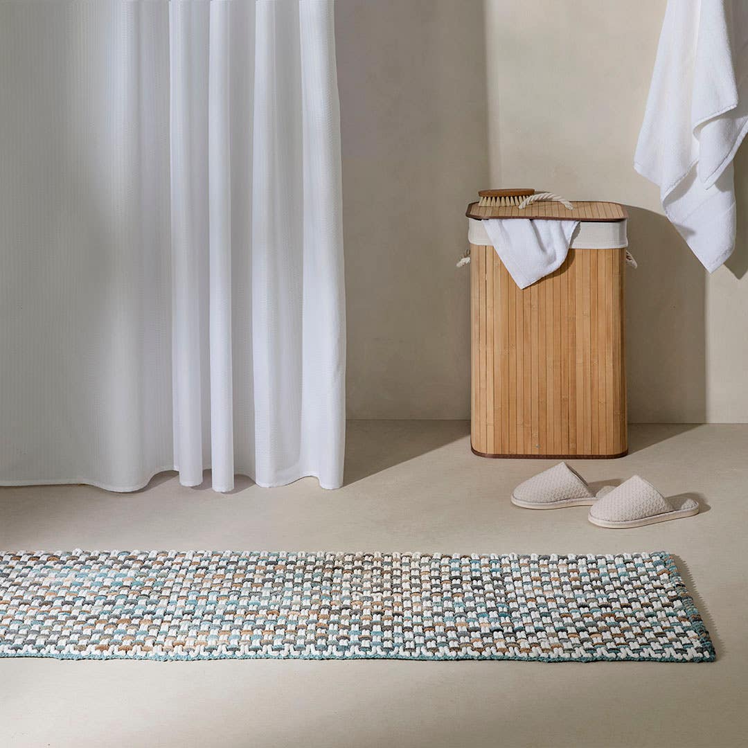 https://s3-ap-southeast-2.amazonaws.com/fusionfactory.commerceconnect.bbnt.production/pim_media/000/210/764/M_F_W26_Oli-Woven-Bath-Runner_Blue_2689001_LS_SI.jpg?1772682617