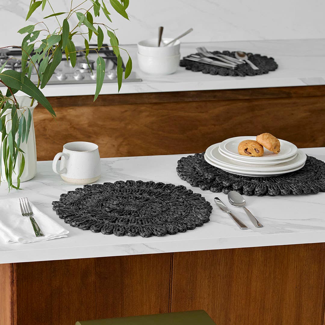 https://s3-ap-southeast-2.amazonaws.com/fusionfactory.commerceconnect.bbnt.production/pim_media/000/210/495/M_F_W26_Studio_LS_Napery_Placemats_Fancy_Florette_Centre_Pattern-Black_SI.jpg?1772503774