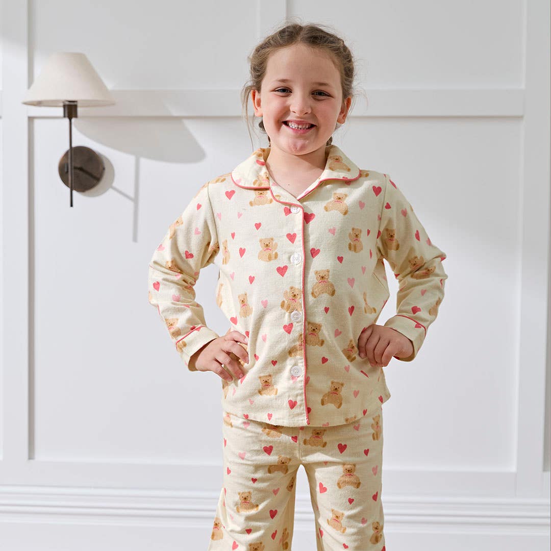 https://s3-ap-southeast-2.amazonaws.com/fusionfactory.commerceconnect.bbnt.production/pim_media/000/207/534/M_F_Winter_26_Studio_Kids_PJs-Flannel_Bear_Hug-1_SI.jpg?1769487245