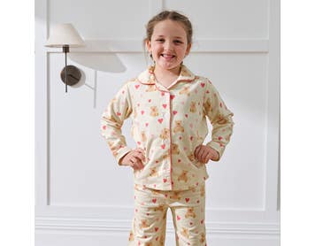 https://s3-ap-southeast-2.amazonaws.com/fusionfactory.commerceconnect.bbnt.production/pim_media/000/207/534/M_F_Winter_26_Studio_Kids_PJs-Flannel_Bear_Hug-1_SI.jpg?1769487245