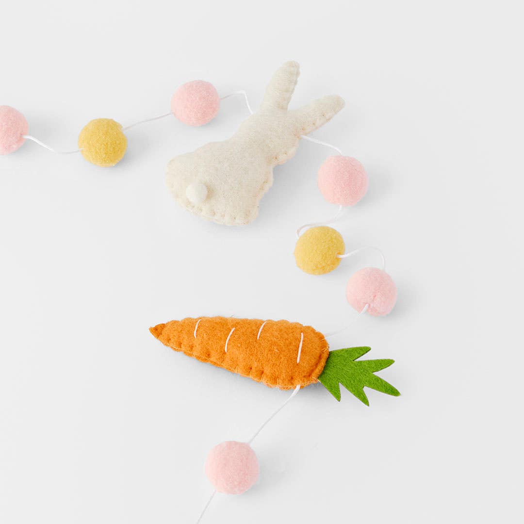 https://s3-ap-southeast-2.amazonaws.com/fusionfactory.commerceconnect.bbnt.production/pim_media/000/185/497/M_F_Wool-Bunny-Pom-Pom-Carrot-Bunting_25932601_Detail_SI.jpg?1735525989