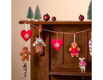 https://s3-ap-southeast-2.amazonaws.com/fusionfactory.commerceconnect.bbnt.production/pim_media/000/213/593/M_F_Xmas-26-27_MR_GARLAND_Gingerbread-House-Garland-Red_22599701_SI.jpg?1779150525
