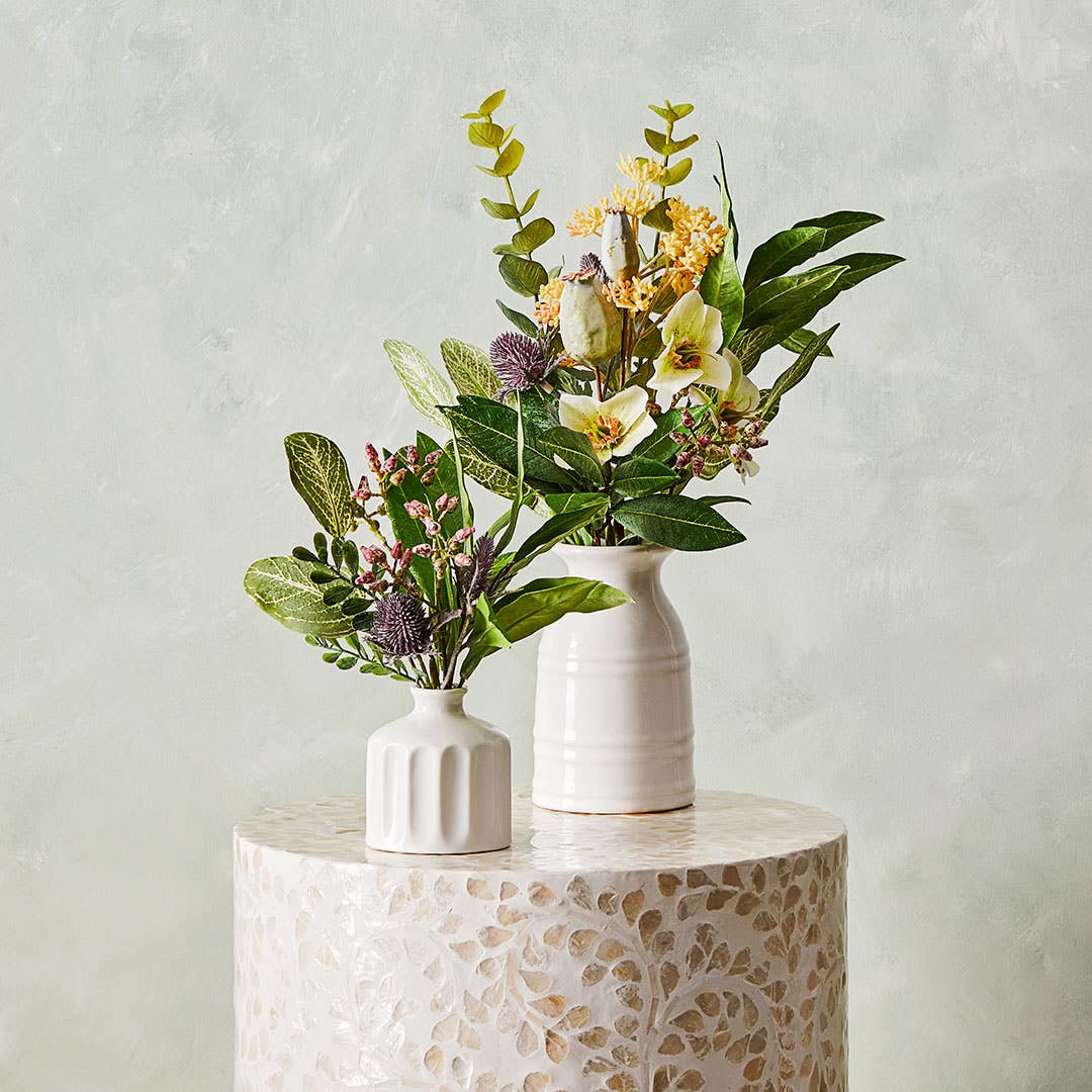 https://s3-ap-southeast-2.amazonaws.com/fusionfactory.commerceconnect.bbnt.production/pim_media/000/158/469/S23-24_LS_Decorator_Alice_Inlay_Stool_Cinnamon_Leaf_in_Ceramic_Vase_Floral___Native_Arrangment_in_Ceramic_SI.jpg?1705292088